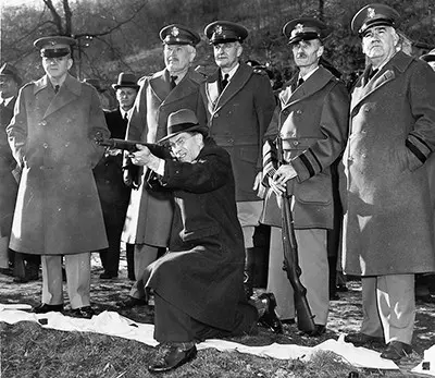 John C. Garand test fires an M1 rifle