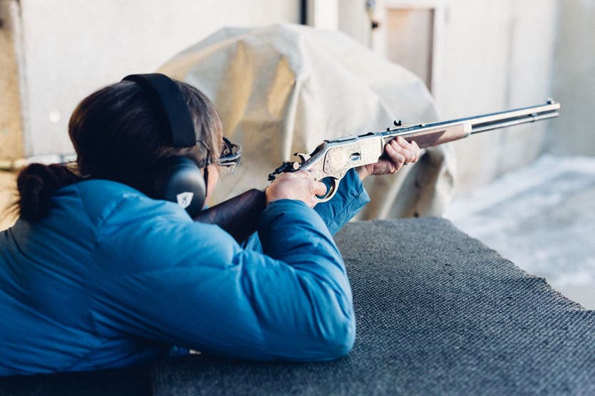 Eva Jensen fires an engraved, limited edition 150th anniversary Model 1873 rifle