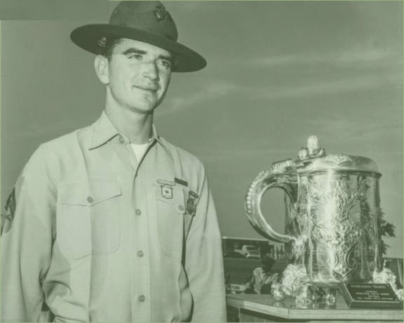 Marine rifleman Carlos N. Hathcock II poses with the Wimbledon Cup trophy