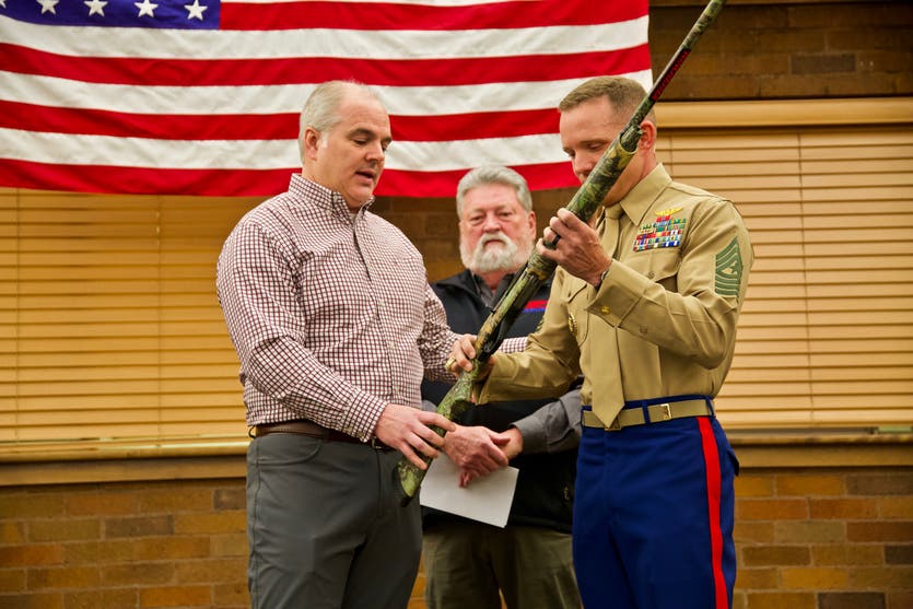 Sgt Maj. Bradley S. Driver, USMC receives a new Winchester shotgun